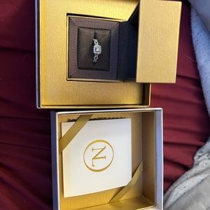 Engagement ring size 9.5. Diamond and white gold.